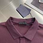 Prada polo shirt collar and placket close-up, burgundy fabric with tag