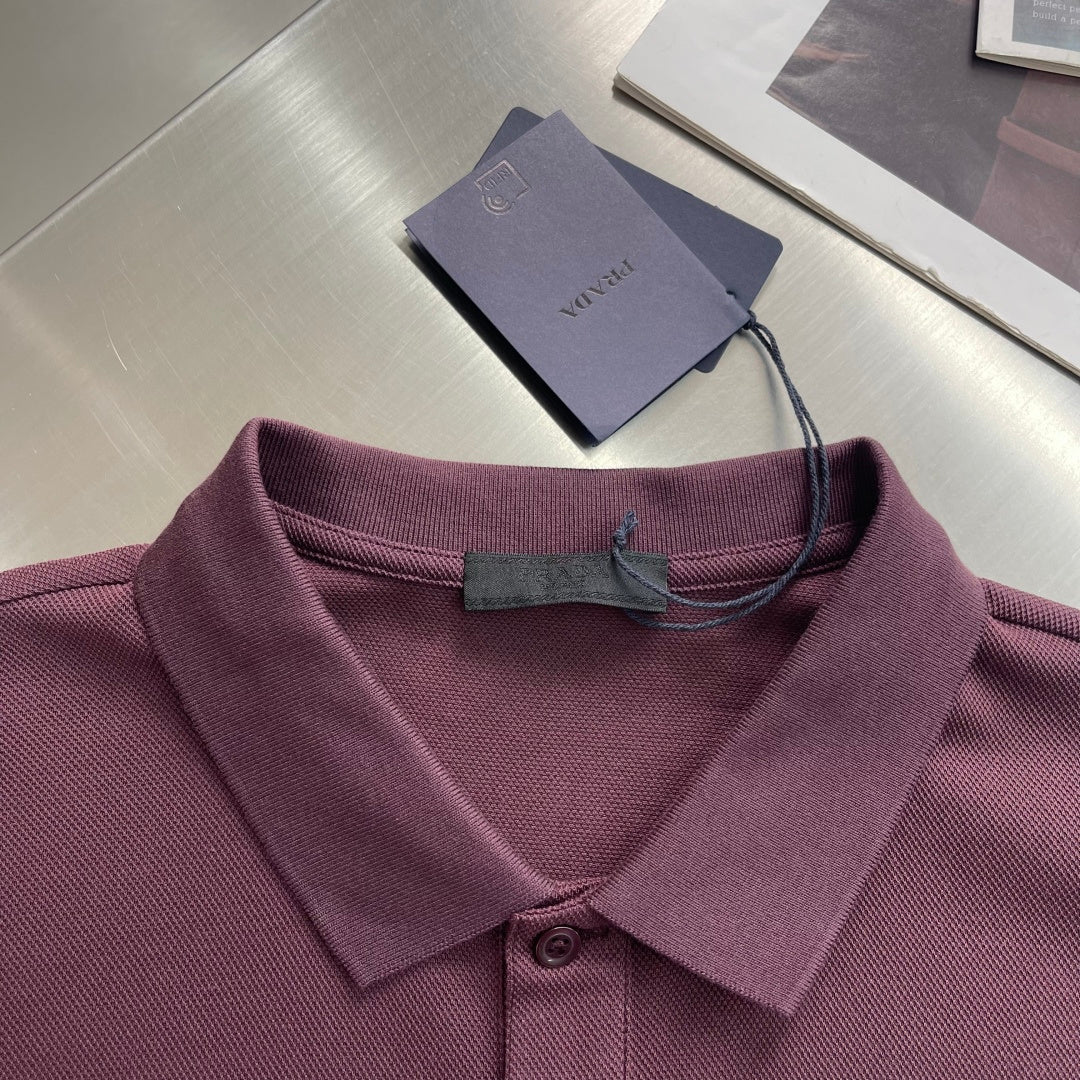 Prada polo shirt collar and placket close-up, burgundy fabric with tag