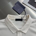 Prada polo shirt collar detail in off-white, with neck button and hanging tag.