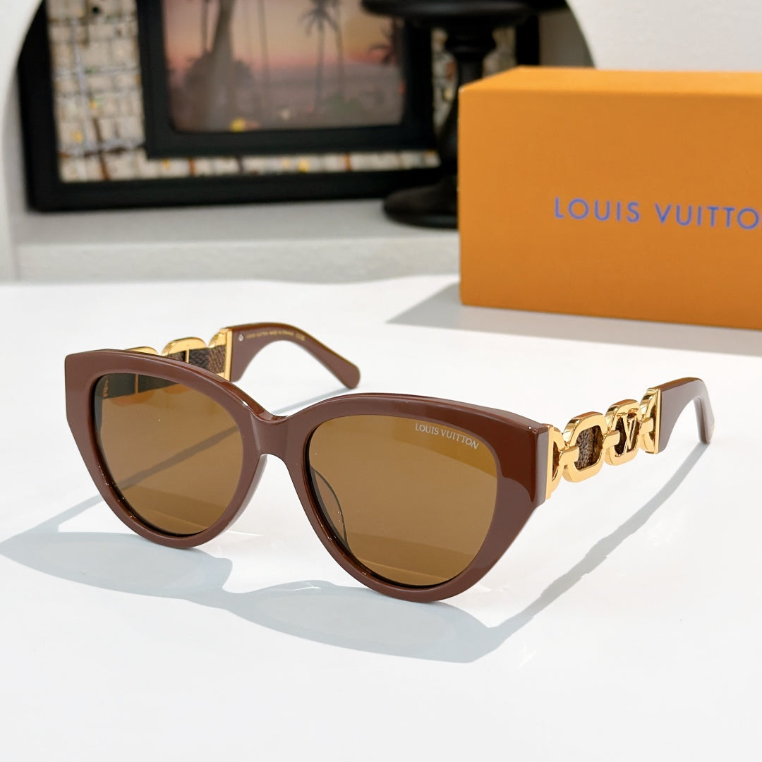 Louis Vuitton cat-eye sunglasses with brown frame, amber lenses, gold chain detail