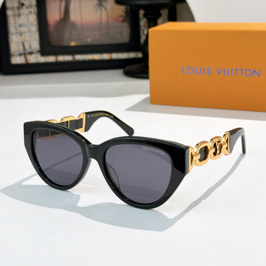 Louis Vuitton cat-eye sunglasses with black frame, dark lenses, gold chain detail