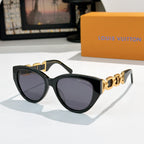 Louis Vuitton cat-eye sunglasses with black frame, dark lenses, gold chain detail