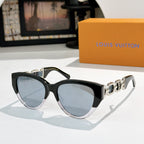 Louis Vuitton cat-eye sunglasses with black frame, blue-tinted lenses, gold chain detail