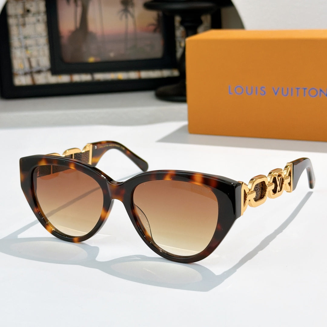 Louis Vuitton cat-eye sunglasses with tortoiseshell frame, brown lenses, gold chain detail