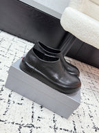Black leather loafers with stitched vamp and low heel, PRADA logo on insole