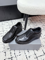 Prada unisex leather lace-up sneakers, dark black, side view pair