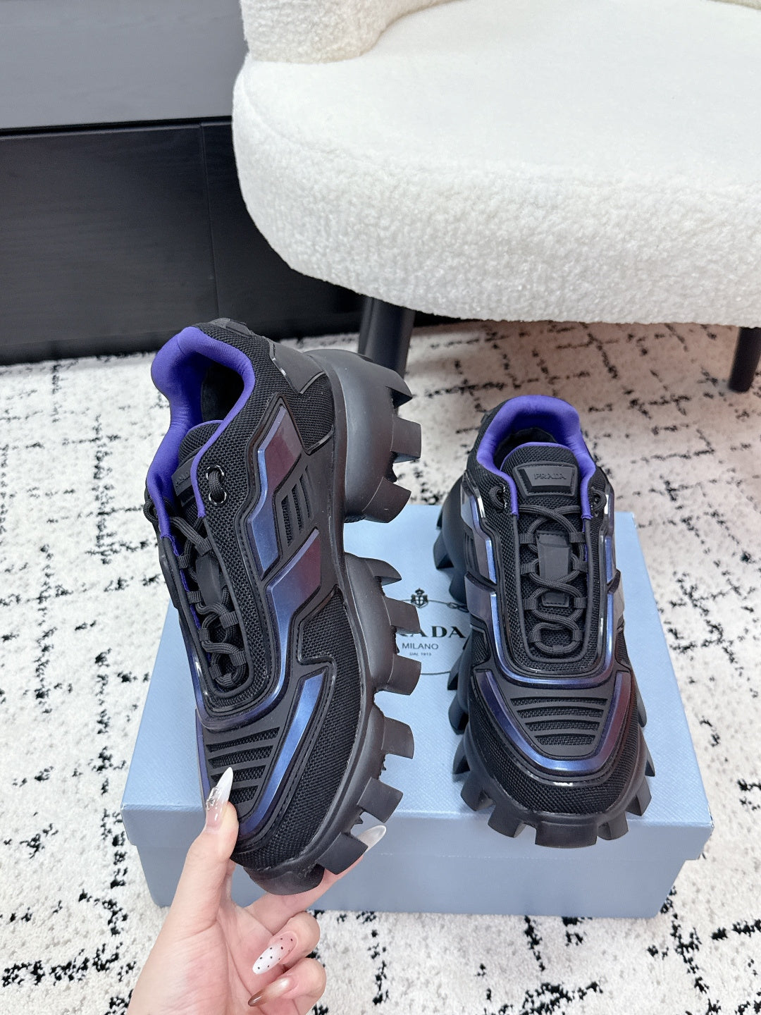 Prada unisex shoes on box, dark gray with blue panels and purple laces