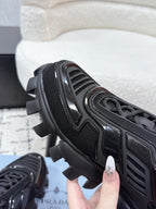 Prada unisex sneakers, black, close-up of tread sole and textured upper