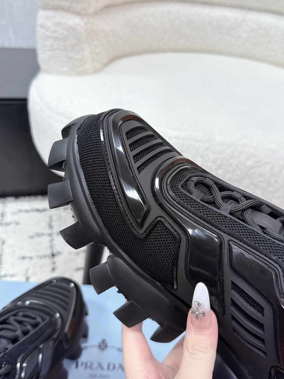 Prada unisex sneakers, black, close-up of tread sole and textured upper