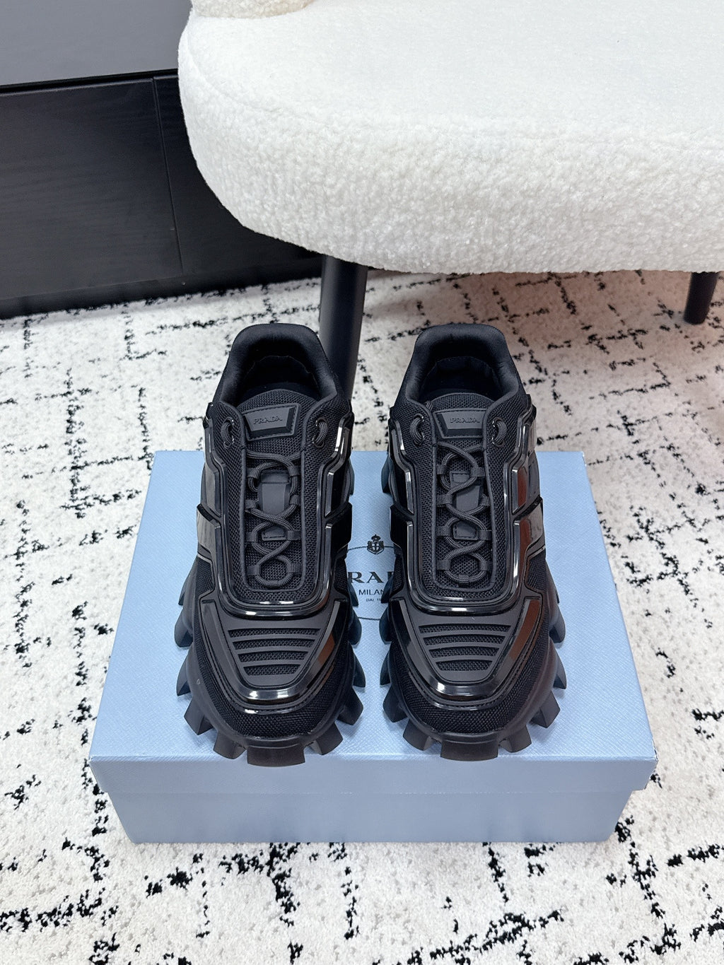 Prada unisex sneakers in black with chunky lug sole and lace-up panel detailing
