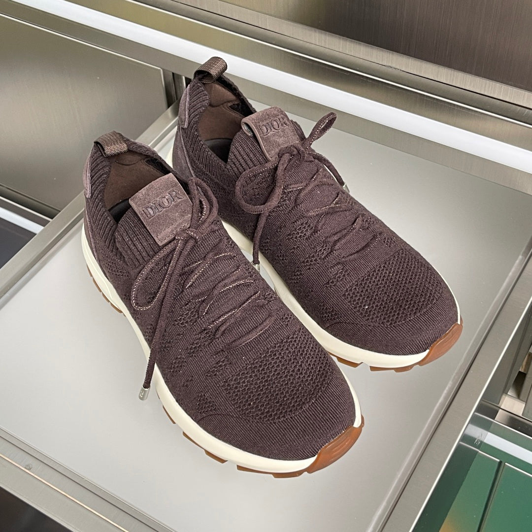 Dior unisex sneakers pair in dark purple knit with lace-up closure and white midsoles