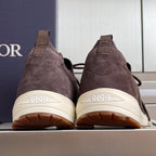 Dior unisex sneakers in dark purple from the heel view with white logo sole