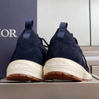 Dark navy unisex sneakers from heel view with DIOR logo and white rubber soles