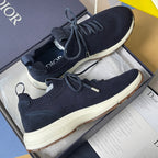 Navy knit unisex sneakers with lace-up closure, padded tongue, and white rubber sole