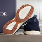 Navy unisex sneakers with visible tread outsole, white midsole, and brown rubber grip