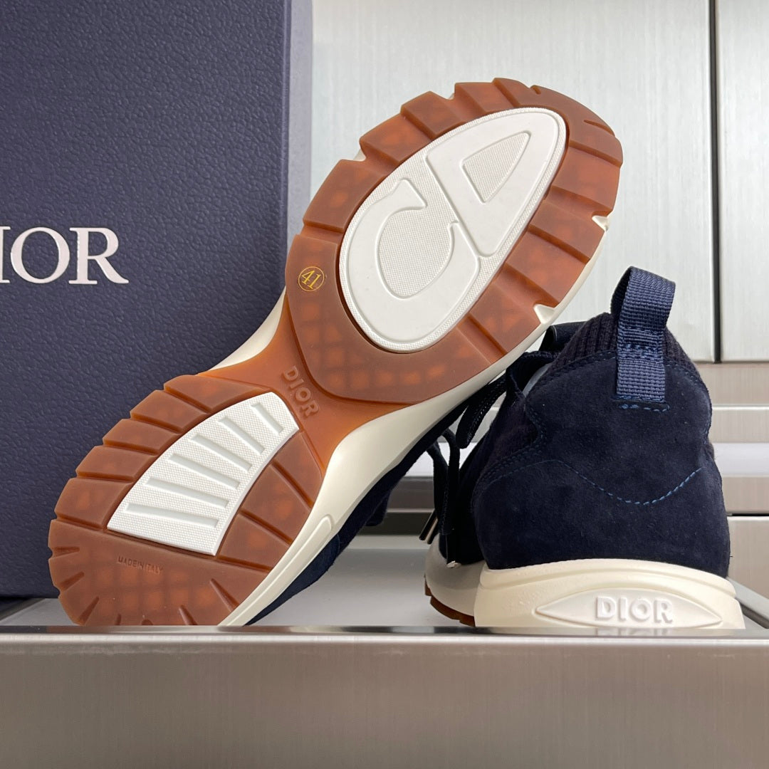 Navy unisex sneakers with visible tread outsole, white midsole, and brown rubber grip