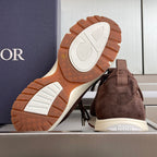 Dior unisex sneaker outsole view with dark brown sole tread and white heel base
