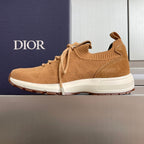Tan lace-up unisex sneakers with ribbed collar, textured knit upper, and white outsole