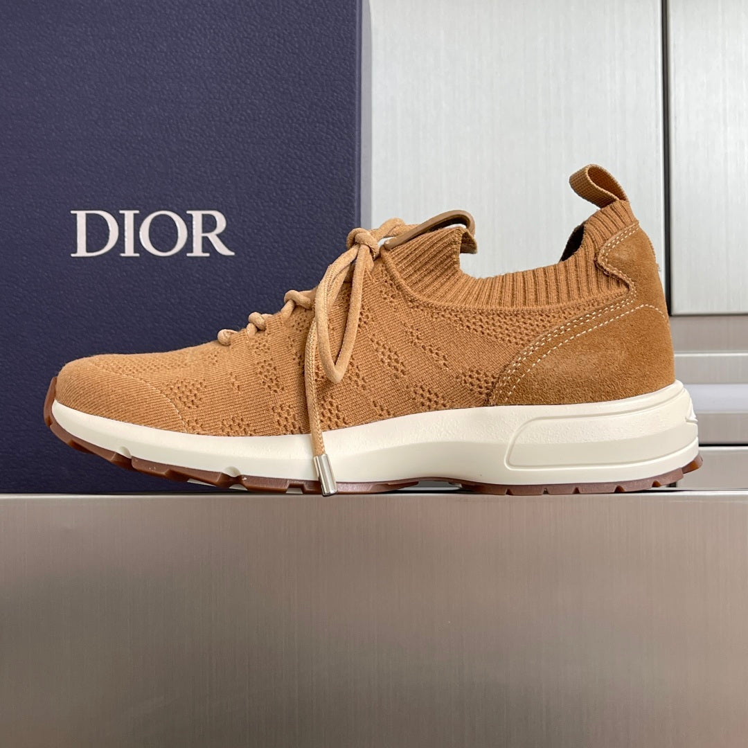 Tan lace-up unisex sneakers with ribbed collar, textured knit upper, and white outsole