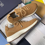 Tan Dior unisex sneakers with lace-up knit upper, elastic collar, and white midsole