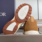 Tan unisex sneaker outsole with tread and Dior logo on the heel sole