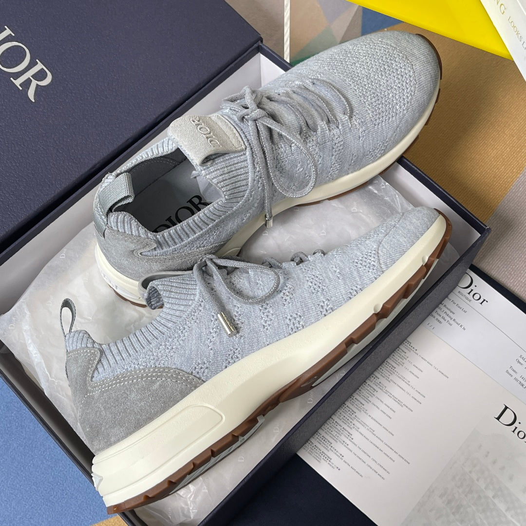 Grey knit sneakers in a box, with lace-up closure and cream sole, Dior heel detail