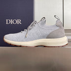 Light grey slip-on knit sneakers with lace-up front and cream sole, Dior on heel