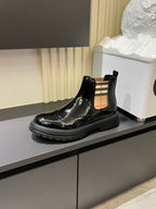 Burberry black patent Chelsea boot with plaid side panel and chunky outsole