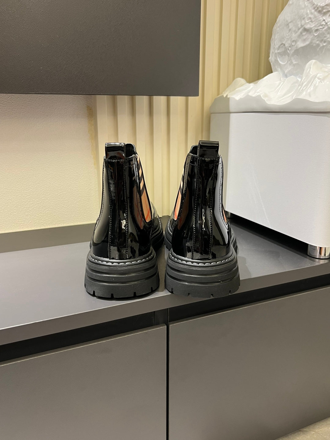 Burberry black patent Chelsea boots with elastic side panels and thick rubber sole