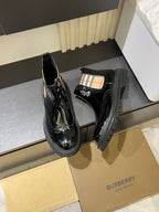 Burberry black patent Chelsea boots with elastic side panels and stacked heel sole