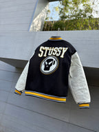 Varsity jacket with black back panel, STUSSY logo patch, striped hem and cuffs