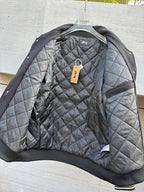 Quilted bomber jacket with ribbed black cuffs and gray diamond quilting