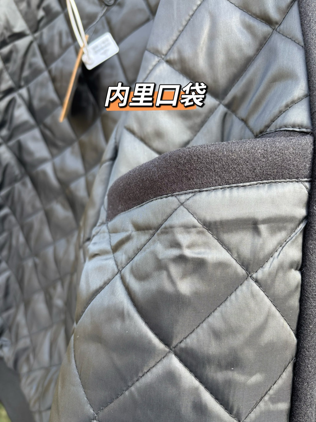 Quilted jacket shoulder with brown interior pocket detail