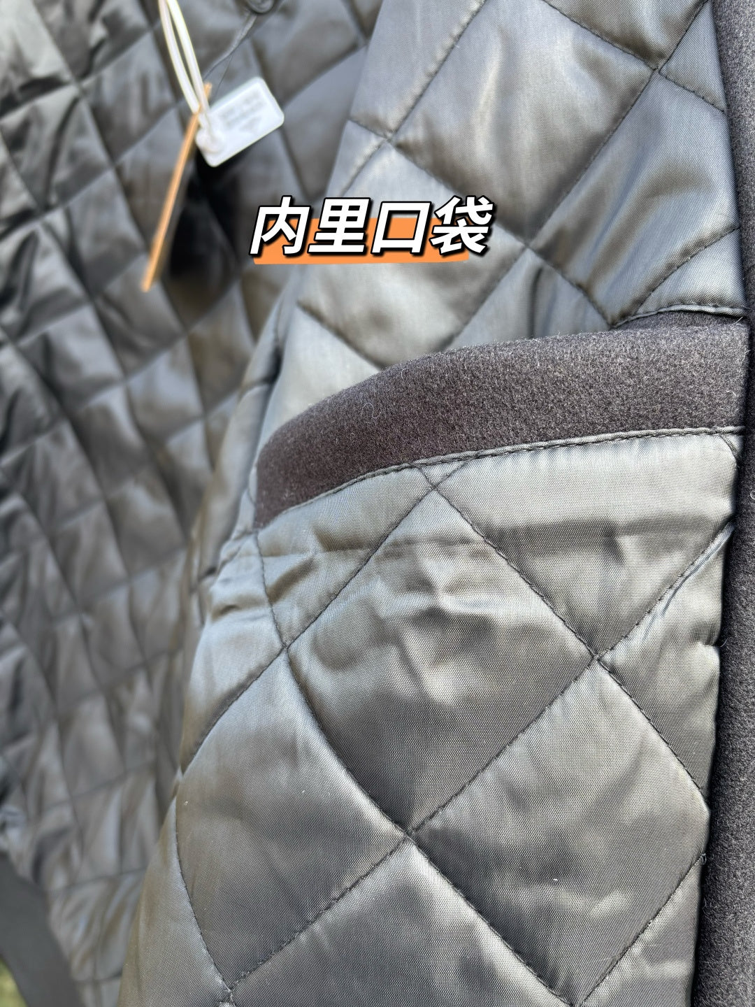 Quilted jacket shoulder with brown interior pocket detail