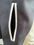 Dark fabric sleeve panel with vertical white stripe detail