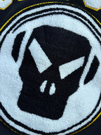 Close-up of Stussy jacket circular logo graphic in white and black