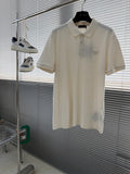 Prada short-sleeve polo shirt in off-white, with button placket and collar.