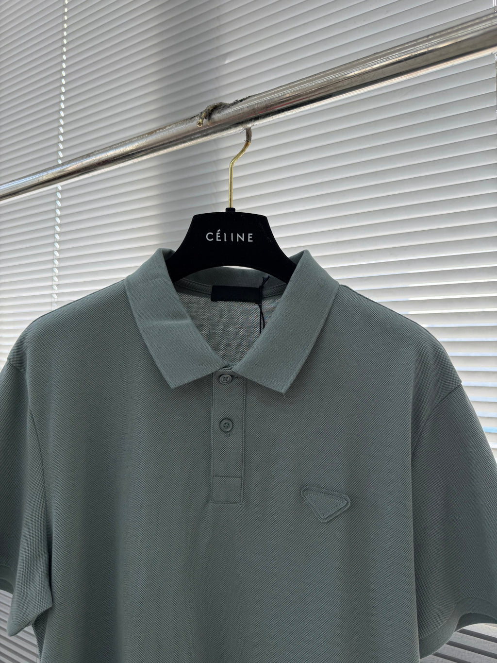 Prada polo shirt, muted teal with foldover collar and embroidered chest emblem