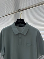 Prada polo shirt, muted teal with foldover collar and embroidered chest emblem