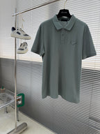 Prada polo shirt, muted teal with buttoned collar and chest pocket