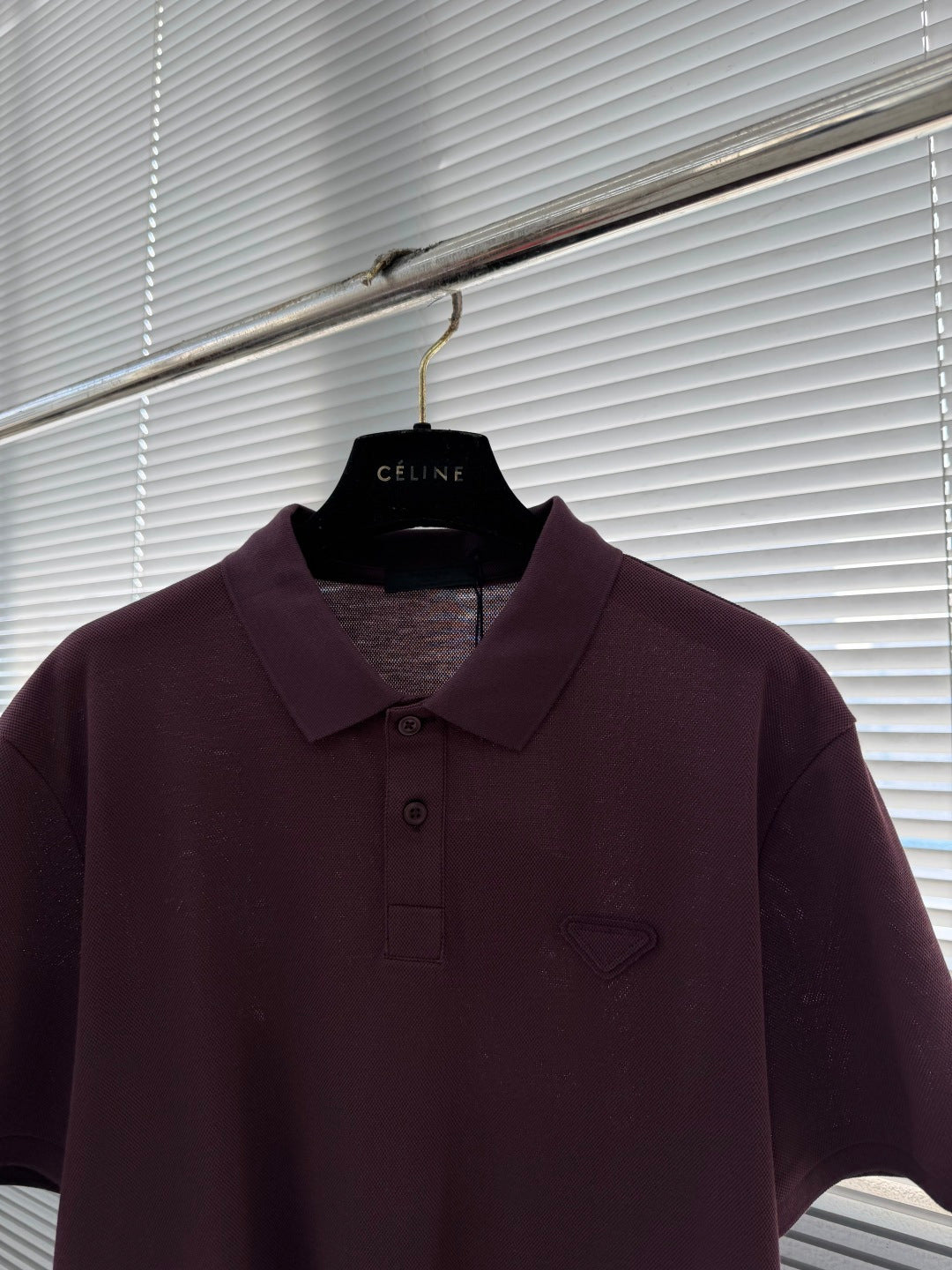 Prada short-sleeve polo shirt detail, burgundy collar and button front