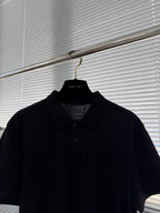 Prada polo shirt on hanger, dark short sleeves with collared neckline