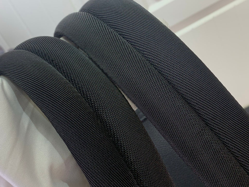 Louis Vuitton bag strap in dark fabric texture
