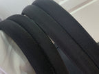Louis Vuitton bag strap in dark fabric texture