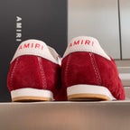 Amiri red suede sneakers rear view, white back heel with AMIRI lettering, gum sole