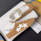 Tan suede sneakers in box, white laces and large white star applique