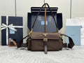 Prada shoulder bag in dark brown with front flap and gold-tone logo triangle