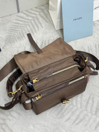 Prada satchel bag in taupe-brown with front zip pockets and crossbody straps