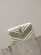 YSL chevron quilted metallic gold flap bag with chain strap, side view