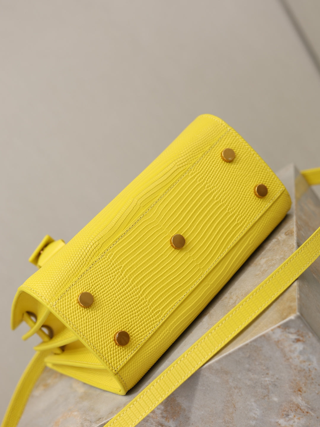 YSL yellow textured crossbody bag with snap buttons on front panel
